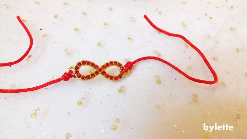 Adjustable red infinity wire bracelet